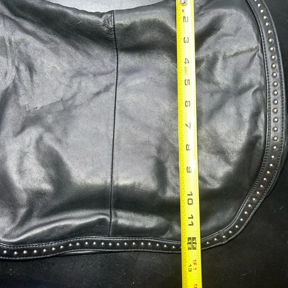 DKNY black leather shoulder bag with stud detailing.